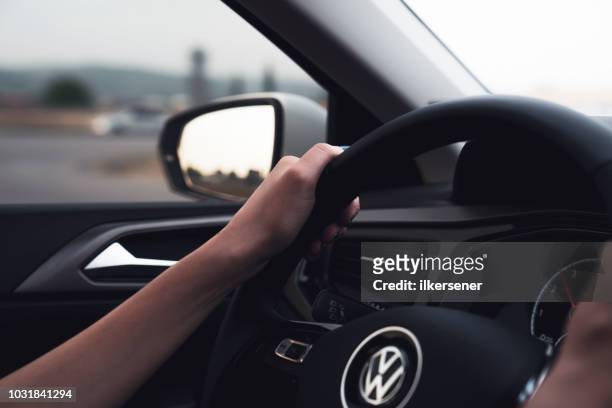 volkswagen polo, steering wheel with logotype - volkswagen stock pictures, royalty-free photos & images