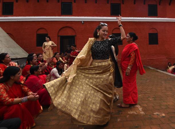 Nepali Hindu women dance after paying homage to Shiva, the Hindu god of destruction, as they celebrate the Teej festival at the Pashupatinath temple...