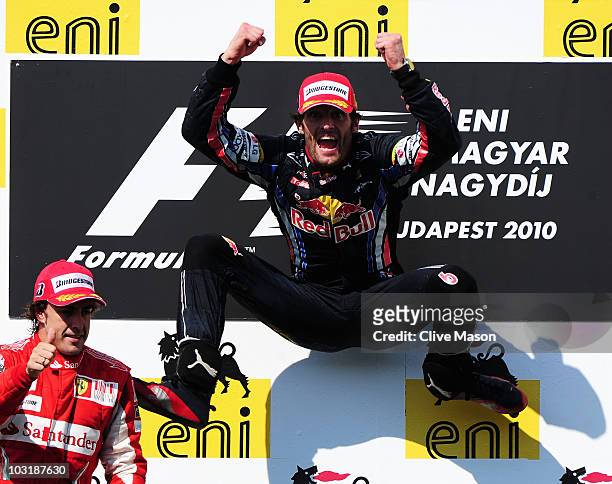 Mark Webber of Australia and Red Bull Racing celebrates on the podium after winning the Hungarian Formula One Grand Prix at the Hungaroring on August...