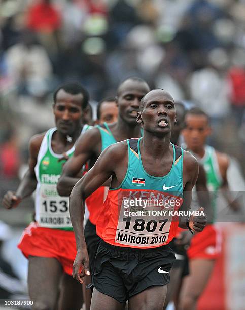 Kenya's Vincent Yator runs ahead of compatriot Edwin Soy during the Men's 5000 metres final event August 1, 2010 during the fifth day the17th CAA...