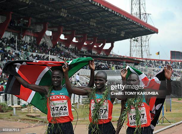 Kenya's Vincent Yator , Edwin Soy and Mark Kiptoo celebrate following the Men's 5000 metres final event August 1, 2010 during the fifth day the17th...