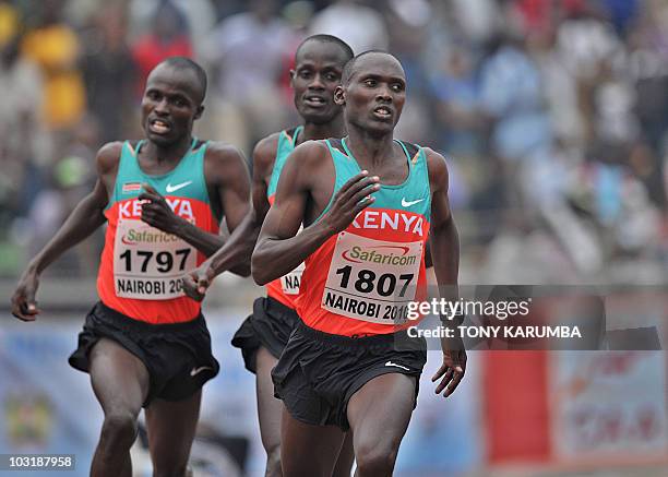 Kenya's winning trio Vincent Yator , Edwin Soy and Mark Kiptoo race to the finish of the Men's 5000 metres final event August 1, 2010 during the...