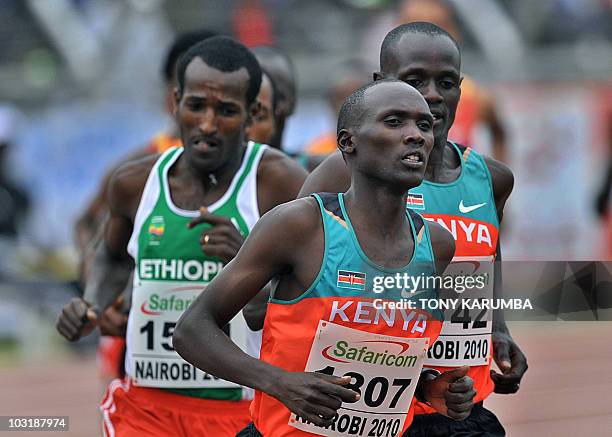 Kenya's Vincent Yator runs ahead of compatriot Mark Kiptoo and Ethiopian Merga Jido during the Men's 5000 metres final event August 1, 2010 during...