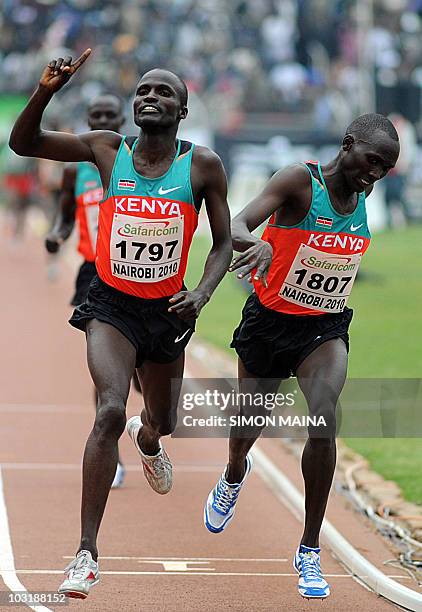 Kenyas Soy Edwin crosses the finishing line past teammate Yator Vincent in the 5000M men final on August 1, 2010 on the fifth day the17th CAA African...