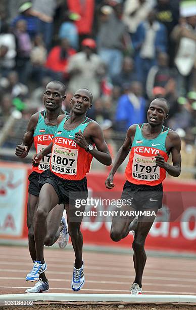 Kenya's winning trio Vincent Yator , Edwin Soy and Mark Kiptoo race to the finish of the Men's 5000 metres final event on August 01, 2010 during the...