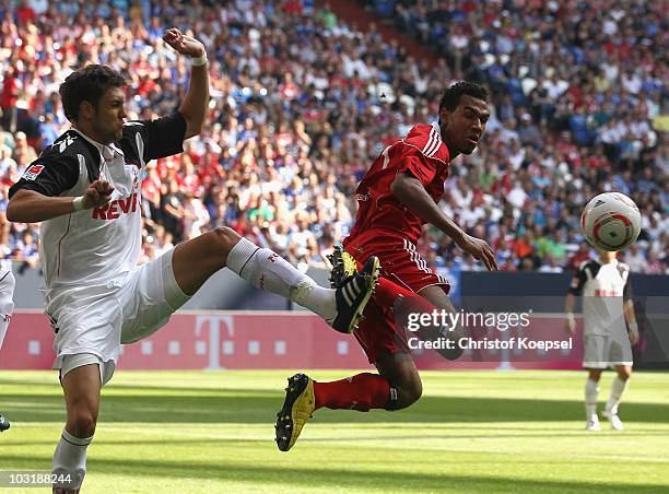 Kevin Pezzoni of Koeln challenges Eric-Maxim Choupo-Moting of Hamburg during the LIGA total! Cup 2010 third place play-off match between Hamburger SV...