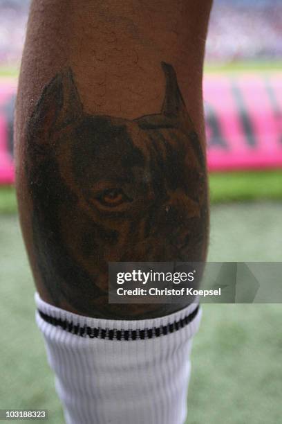 The calf of Petiti of Koeln shows a tattoo of a dog during the LIGA total! Cup 2010 third place play-off match between Hamburger SV and 1. FC Koeln...