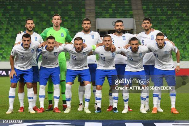 Greece's players, midfielder Lazaros Christodoulopoulos, midfielder Anastosios Donis, defender captain Vasilis Torosidis, midfielder Dimitris Pelkas,...