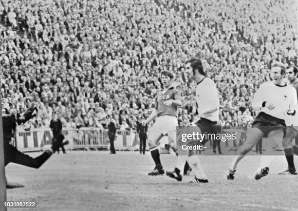 German midfielder Wimmer scores against the Soviet Union as forward Gerd Muller looks on during the European Nations soccer championship final 18...