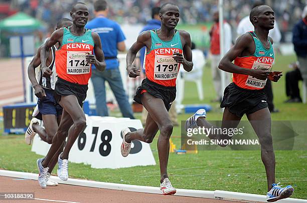 Kenyas Soy Edwin runs to lead teammates Yator Vincent and Kiptoo Mark in the 5000 metres men's final on August 1, 2010 on the fifth day the17th CAA...