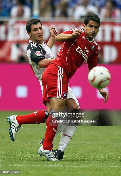 Mato Jajalo of Koeln challenges Romeo Castelen of Hamburg during the LIGA total! Cup 2010 third place play-off match between Hamburger SV and 1. FC...