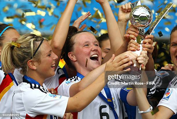 Marina Hegering , team captain of Germany lifts the trophy after the 2010 FIFA Women's World Cup Final match between Germany and Nigeria at the FIFA...
