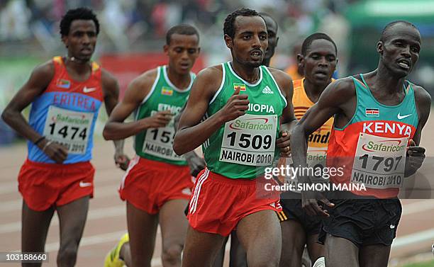 Kenya's Soy Edwin runs past Ethiopias Bekele Tariku in the 5000M men final on August 1, 2010 on the fifth day the17th CAA African Atheletics...