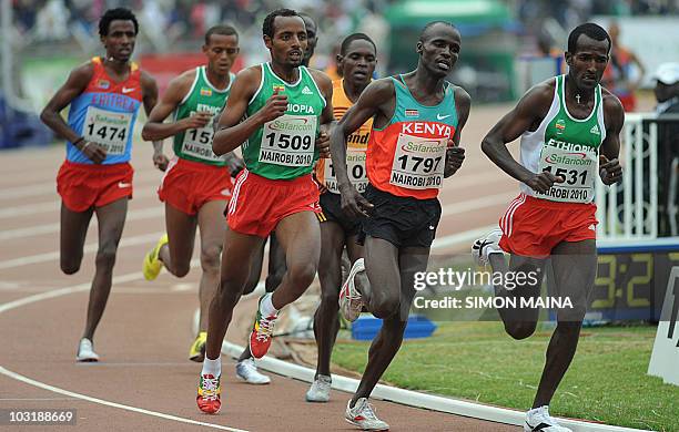 Kenya's Soy Edwin runs past Ethiopias Bekele Tariku and Merga Imane in the 5000M men final on August 1, 2010 on the fifth day the17th CAA African...