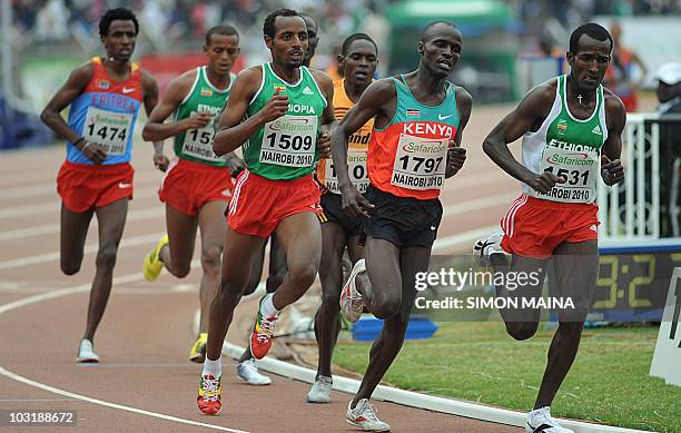 Kenya's Soy Edwin runs past Ethiopias Bekele Tariku and Merga Imane in the 5000M men final on August 1, 2010 on the fifth day the17th CAA African...