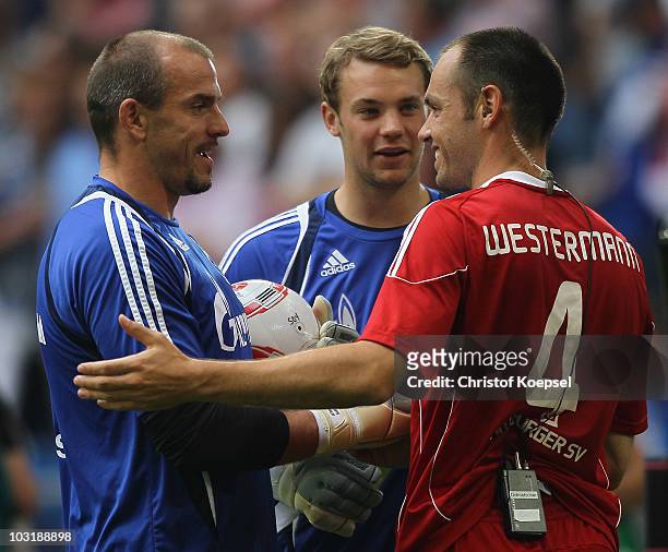 Mathias Schober, Manuel Neuer of Schalke and Heiko Westermann of Hamburg talk after the LIGA total! Cup 2010 third place play-off match between...