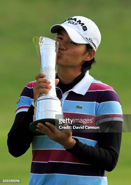 Yani Tseng of Taiwan kisses the trophy after claiming a 1 stroke victory during the final round of the 2010 Ricoh Women's British Open at Royal...