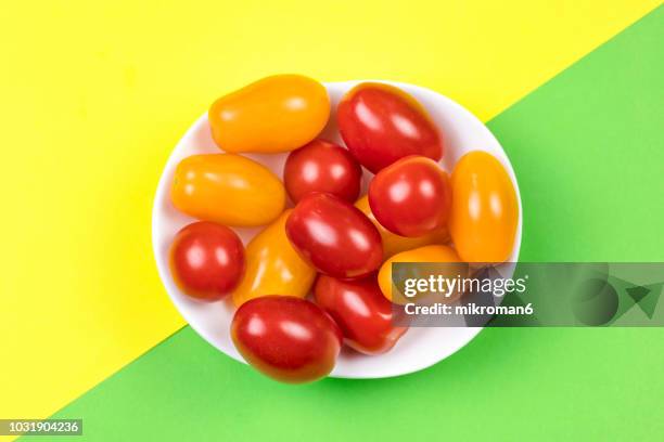 variety of multicolor organic heirloom tomatoes, cherry tomatoes of different colors - tomate cerise photos et images de collection