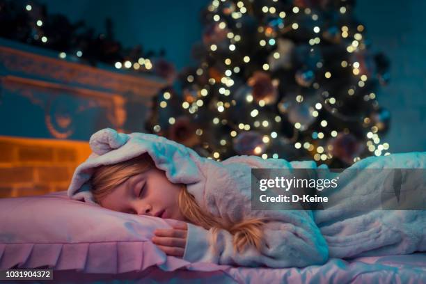 christmas - child asleep in bedroom at night stock pictures, royalty-free photos & images