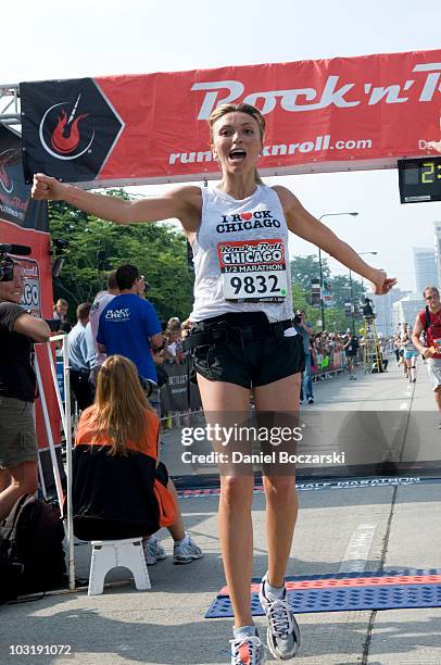 Giuliana Rancic crosses the finish line at the Rock 'n' Roll Chicago Half Marathon on August 1, 2010 in Chicago, Illinois.