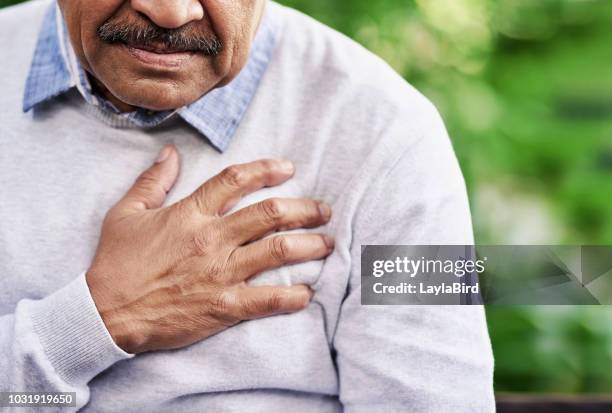 chest pain can have a variety of causes - old man chest stock pictures, royalty-free photos & images