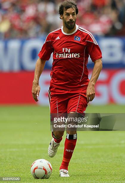Ruud van Nistelrooy of Hamburg runs with the ball during the LIGA total! Cup 2010 third place play-off match between Hamburger SV and 1. FC Koeln at...