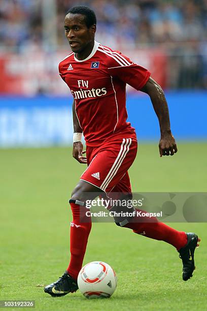 Ze Roberto of Hamburg runs with the ball during the LIGA total! Cup 2010 third place play-off match between Hamburger SV and 1. FC Koeln at the...