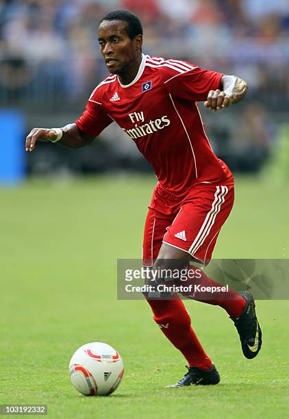 Ze Roberto of Hamburg runs with the ball during the LIGA total! Cup 2010 third place play-off match between Hamburger SV and 1. FC Koeln at the...