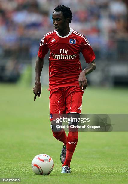 Jonathan Pitroipa of Hamburg runs with the ball during the LIGA total! Cup 2010 third place play-off match between Hamburger SV and 1. FC Koeln at...