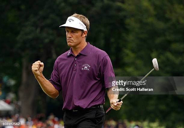 Stuart Appleby of Australia reacts after his birdie putt on the 18th green to finish with an 11-under par 59 during the final round of the Greenbrier...