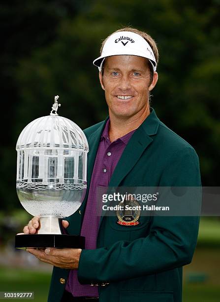 Stuart Appleby of Australia poses with the winner's trophy after his victory at the Greenbrier Classic on The Old White Course at the Greenbrier...