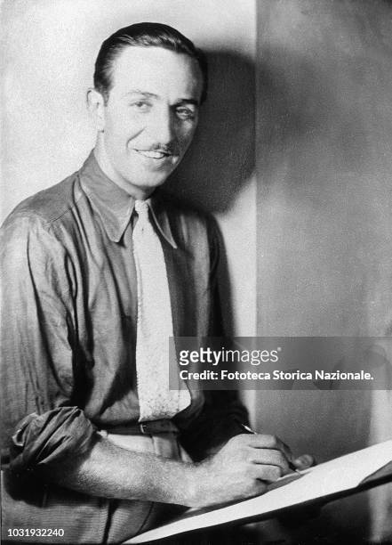 Walt Disney , animator, entrepreneur, designer, filmmaker, voice actor and American film producer, portrayed while drawing on a sketch pad. Portrait...