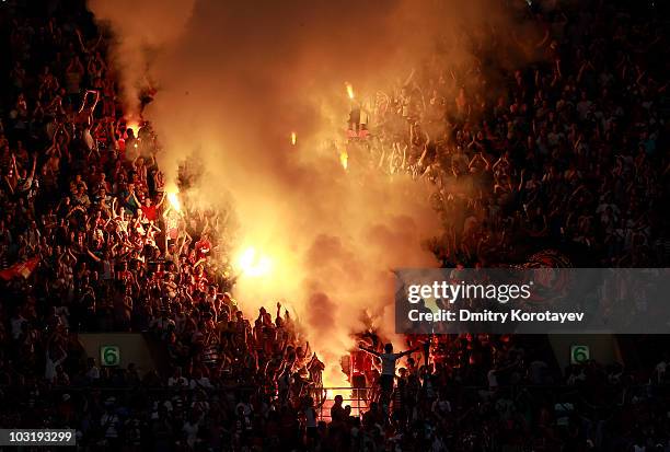 Fans light flares during the Russian Football League Championship match between FC Spartak Moscow and PFC CSKA Moscow at the Luzhniki Stadium on...