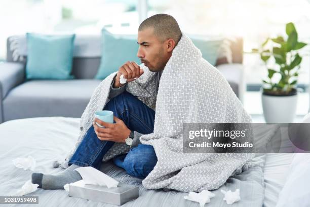 hij is een beetje onder het weer - symptom stockfoto's en -beelden