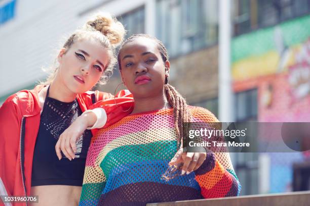 two fashionable young women in urban environment - street style fashion london stock pictures, royalty-free photos & images