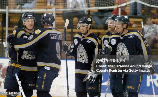 Long Beach Ice Dog Bill Lindsay , left, is congratulated by teammates Evan Cheverie , Marco ROse , Chirs Kenady and Steeve Villeneuve after Lindsay...