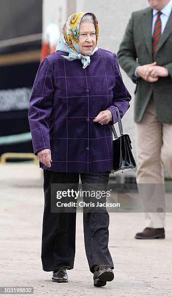 Queen Elizabeth II disembarks the Hebridean Princess with other members of the Royal Family in Scrabster Harbour on August 2, 2010 in Scrabster,...