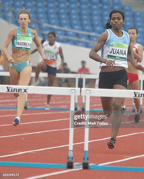 Juana Murmu on way to a gold medal in the 400m hurdles at the Asian All-Star meet in New Delhi on July 30, 2010.