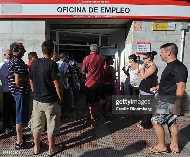 Jobseekers line up at an employment center in Madrid, Spain, on Monday, Aug. 2, 2010. The Spanish government may consider stopping payments to people...