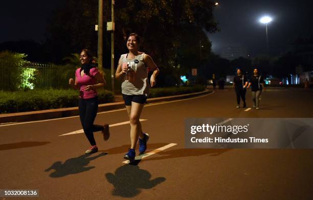 Women participate in the The Fearless Run, a midnight run of 5 kilometers which was organised by the Delhi Police in association with the NGO United...