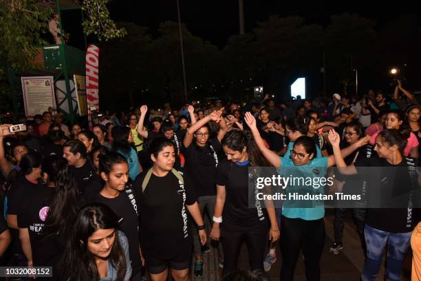 Women participate in the The Fearless Run, a midnight run of 5 kilometers which was organised by the Delhi Police in association with the NGO United...