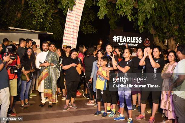 Women participate in the The Fearless Run, a midnight run of 5 kilometers which was organised by the Delhi Police in association with the NGO United...