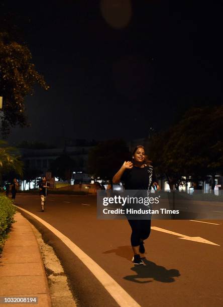 Women participate in the The Fearless Run, a midnight run of 5 kilometers which was organised by the Delhi Police in association with the NGO United...