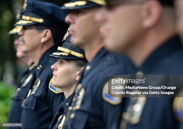Officer Lisa Lopez stands at attention with fellow officers during the Long Beach Police and Fire Memorial Service on May 8, 2012.