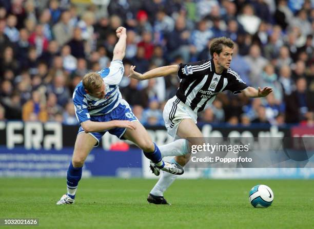 Michael Owen of Newcastle evading a tackle by Brynjar Gunnarsson of Reading during the Barclays Premier League match between Reading and Newcastle...