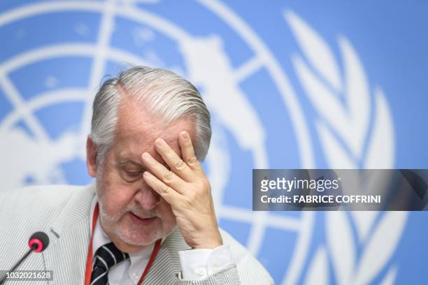 Chairman of the United Nations Commission of Inquiry on Syria, Paulo Sergio Pinheiro reacts as he speaks during a press conference to present the...