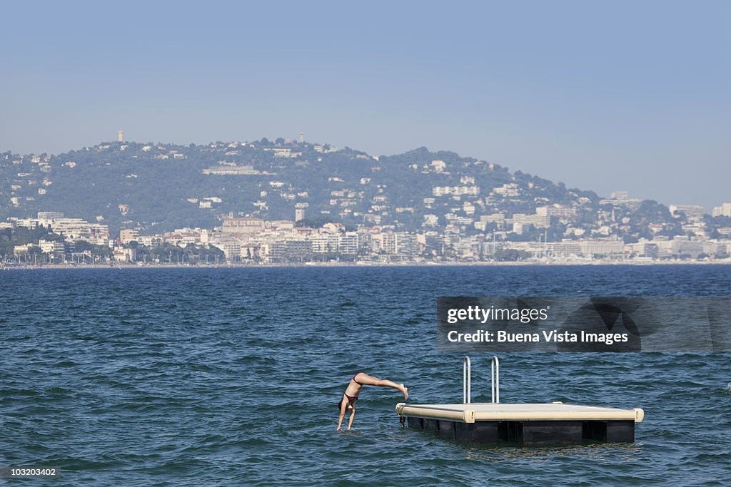 Girl diving into the sea