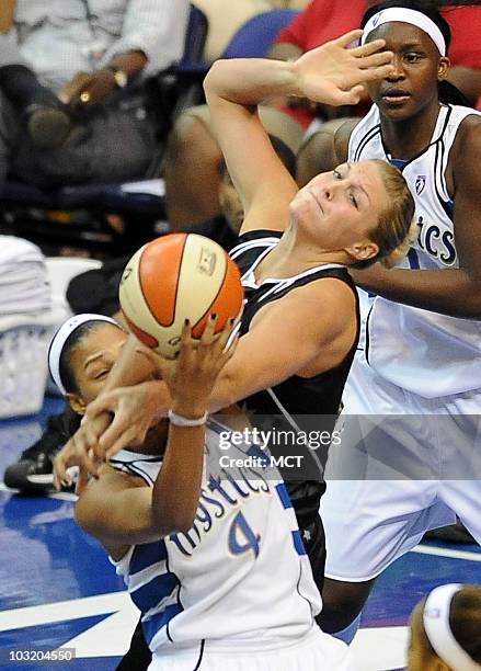 The Washington Mystics' Marissa Coleman battle for a rebound with the San Antonio Silver Stars' Jayne Appel during the fourth quarter. The Silver...