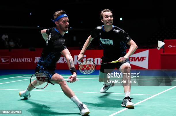 Mathias Boe and Carsten Mogensen of Denmark compete in the Men's Doubles first round match against Mark Lamsfuss and Marvin Emil Seidel of Germany on...