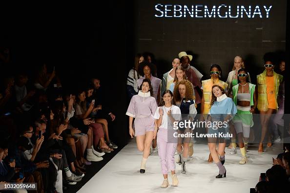 Designer Sebnem Gunay and models acknowledge the applause of the ...